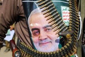 A supporter of the Houthis has a poster attached to his waist of Iranian Major-General Qassem Soleimani, head of the elite Quds Force, who was killed in an air strike at Baghdad airport, during a rally to denounce the U.S. killing, in Saada, Yemen January 6, 2020. The writing on the poster reads: "God is the Greatest, Death to America, Death to Israel, Curse on the Jews, Victory to Islam." REUTERS/Naif Rahma