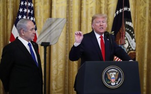 President Donald Trump, joined by Israeli Prime Minister Benjamin Netanyahu, speaks during an event in the East Room of the White House in Washington, Tuesday, Jan. 28, 2020, to announce the Trump administration's much-anticipated plan to resolve the Israeli-Palestinian conflict. (AP Photo/Alex Brandon)
