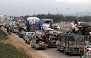 A general view of vehicles carrying belongings of internally displaced Syrians from western Aleppo countryside, in Hazano near Idlib, Syria, February 11, 2020. REUTERS/Khalil Ashawi