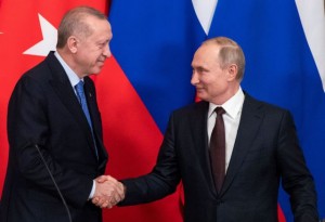 Russian President Vladimir Putin and Turkish President Tayyip Erdogan shake hands during a news conference following their talks in Moscow, Russia March 5, 2020. Pavel Golovkin/Pool via REUTERS