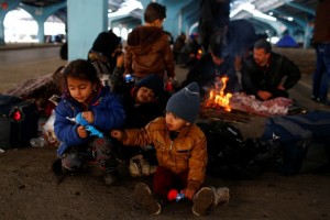 Migrant children are seen in a marketplace area next to Tunca river in Edirne, Turkey, March 5, 2020. REUTERS/Huseyin Aldemir