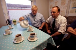 FILE PHOTO: Britain's Prime Minister Boris Johnson and Health Secretary Matt Hancock have tea with members of staff as they visit Bassetlaw District General Hospital in Worksop, Britain November 22, 2019. Picture taken November 22, 2019. Christopher Furlong/Pool via REUTERS/File Photo