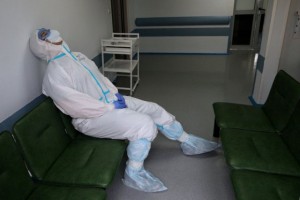 A medical specialist wearing a personal protective equipment (PPE) rests in the hospital No. 1 named after N.I. Pirogov, which delivers treatment to patients infected with the coronavirus disease (COVID-19), in Moscow, Russia May 23, 2020. Kirill Zykov/Moscow News Agency/Handout via REUTERS ATTENTION EDITORS - THIS IMAGE HAS BEEN SUPPLIED BY A THIRD PARTY. MANDATORY CREDIT.