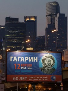 A board with Yuri Gagarin's portrait with backdrop of Moscow International Business Centre, also known as "Moskva-City", is seen on the eve of Cosmonautics Day, in Moscow, Russia April 11, 2021. The bottom sign reads "60 years of manned space exploration". REUTERS/Shamil Zhumatov