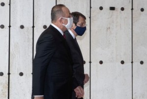 Cypriot President and Greek Cypriot leader Nicos Anastasiades and Turkish Foreign Minister Mevlut Cavusoglu walk before a meeting at the United Nations European headquarters in Geneva, Switzerland April 28, 2021. Stavros Ioannides/PIO/Handout via REUTERS ATTENTION EDITORS THIS IMAGE HAS BEEN SUPPLIED BY A THIRD PARTY